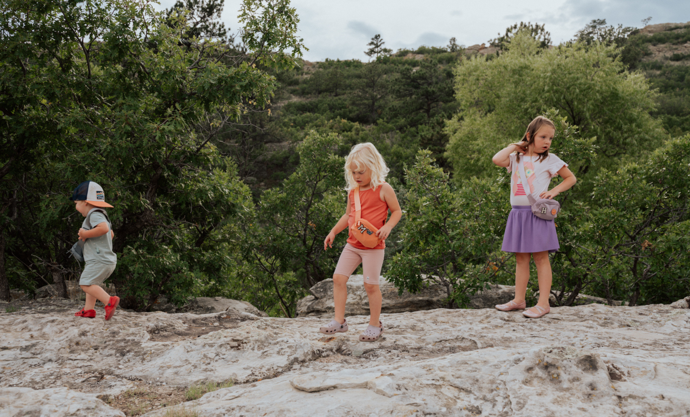 Parker Kids Belt Bag holding small travel essentials for kids during a family adventure.